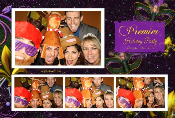 clients enjoying photo booth in their Masquerade Ball Hilton Santa Clara holiday party